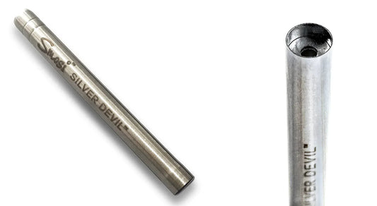 woman smoking out of a one-hitter metal pipe